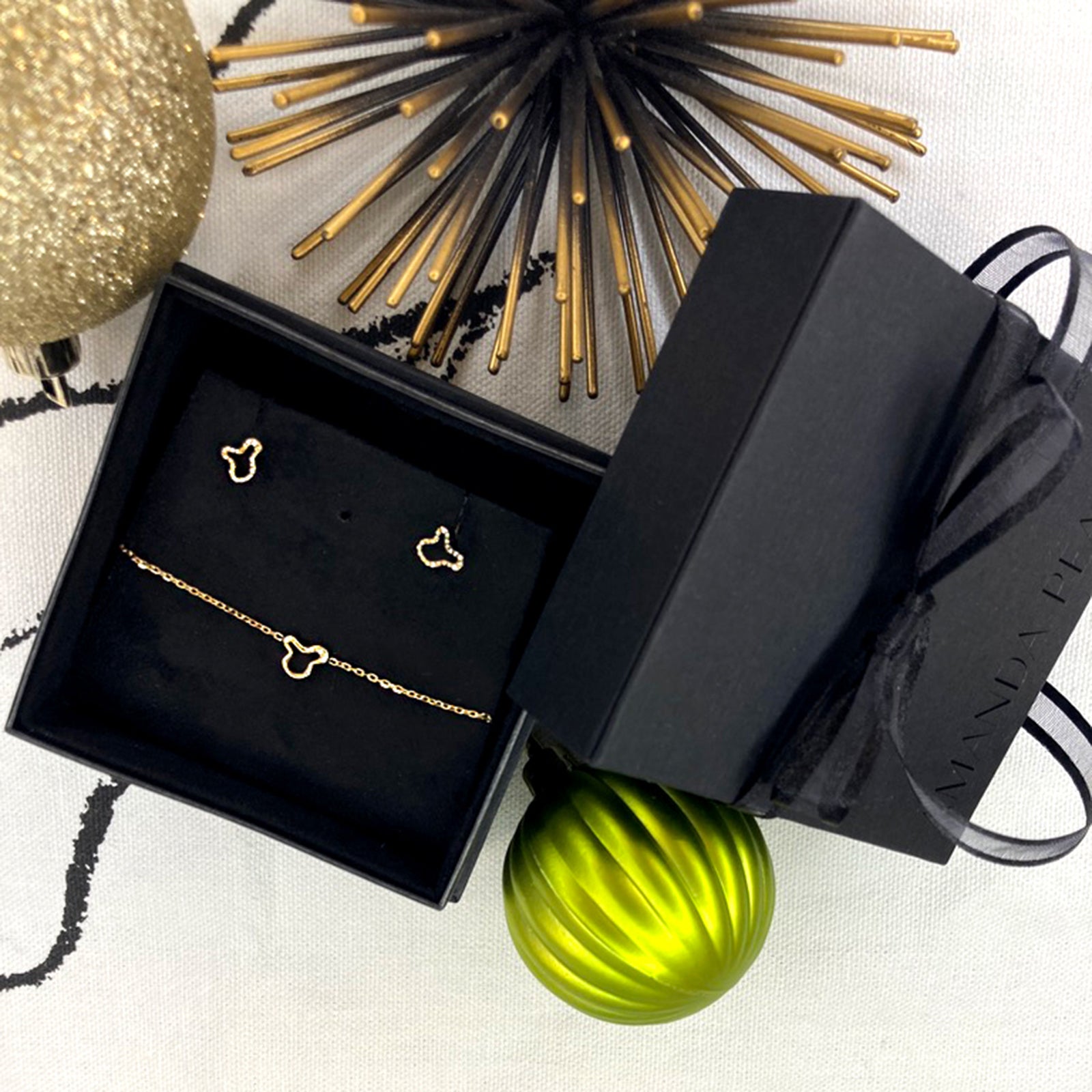STOCKING STUFFERS: Holiday Gifting, Gold Jewelry Gifts, Best fine jewelry gifts. Black packaging with black bow open with Ripple studs styled with the ripple chain necklace inside 