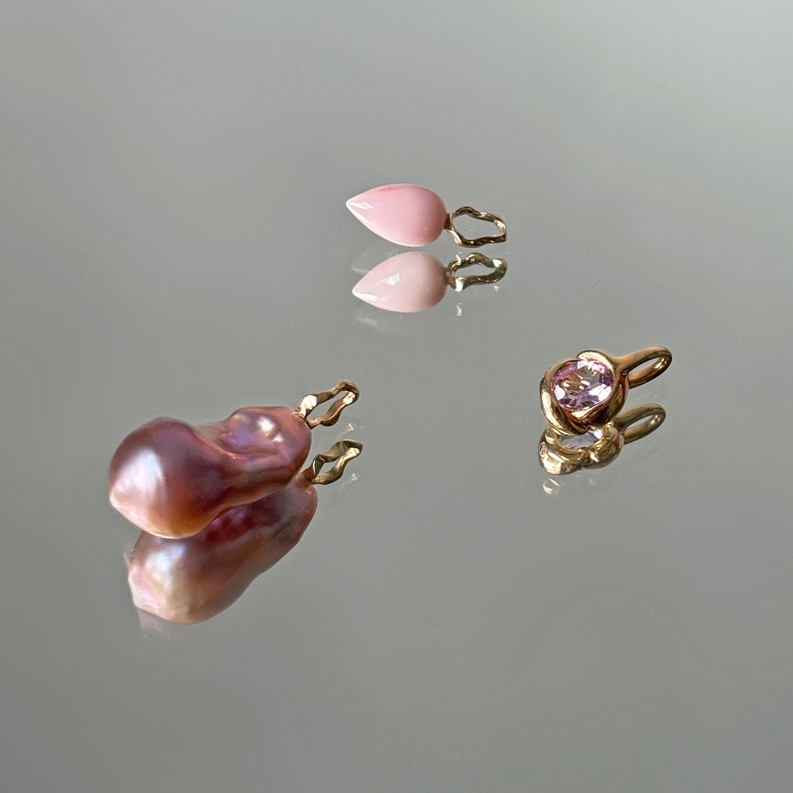 Ripple rings with small, marquise cut colored gemstones.
