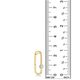 A 14K YG paperclip charm is displayed on a white background with a ruler next to it for scale. It demonstrates that the charm lock is 25mm in height. The charm lock features a small white diamond which sparkles.