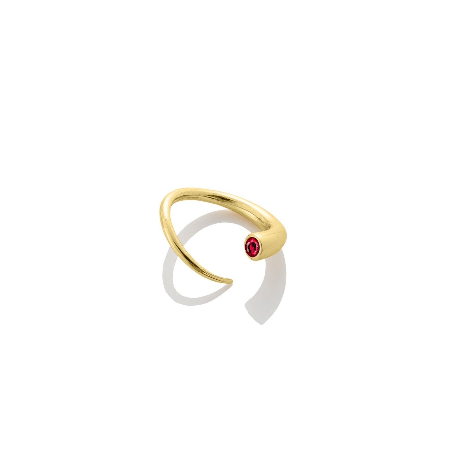 14k recycled yellow gold Quill Bypass Ring with bezel set Ruby on a white background.