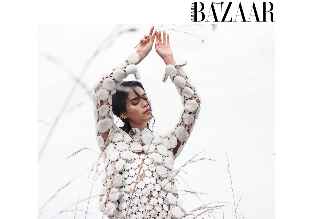 Juana Burga wearing AMANDA PEARL Quill jewlery with a white Courreges dress  in Harper's Bazaar Arabia.