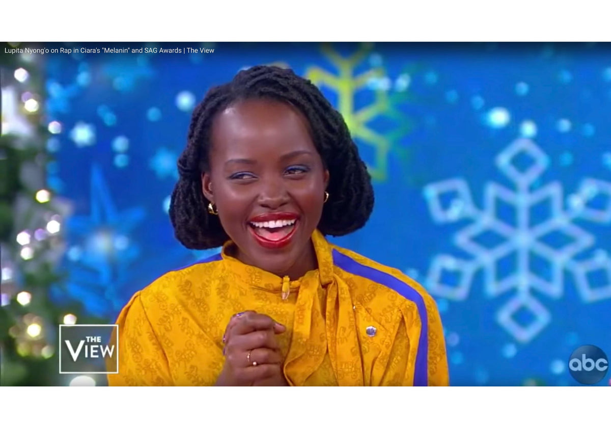 Lupita Nyong'o wearing an AMANDA PEARL Quill Bypass Ring on The View TV show.