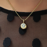 14K Recycled Gold Molten Round Solitaire Charm with Diamond layered on a 2mm bead chain on neck