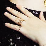 14K Recycled Gold Ripple with marquise stacked with Full Pavé and Plain Ripple Ring on a hand