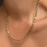 6mm irregular cable chain with small diamond charm lock on a model's neck.
