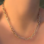 A 14K 8mm irregular cable necklace on a model's neck.