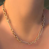 A 14K 8mm irregular cable necklace on a model's neck.