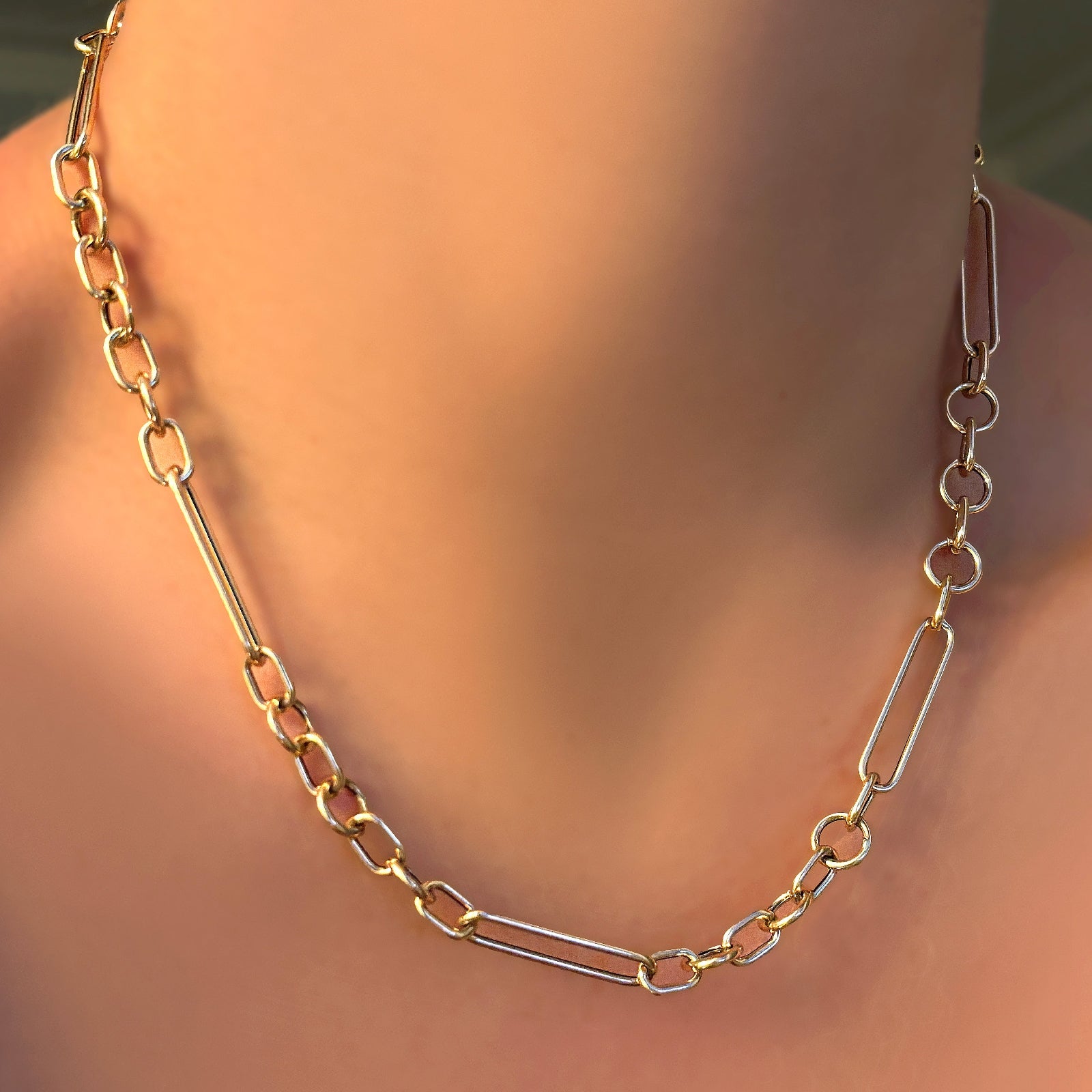 A 14K 8mm irregular cable necklace on a model's neck.