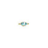 A 14K yellow gold marquise ring, with a bezel set faceted blue topaz gemstone, sits on a white background with drop shadow.
