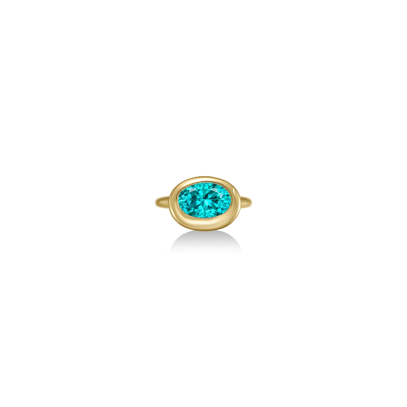 A 14K yellow gold oval ring, with a bezel set faceted paraiba tourmaline gemstone, sits on a white background with drop shadow.