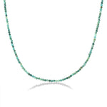Shimmering slim gemstone beaded necklace made of 2mm faceted stones in Turquoise on a gold linking lobster clasp on a white background