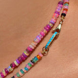 14K gold Small Turquoise Charm Lock on a smooth opal necklace layered with a pink fuchsia opal necklace on a neck