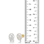Baroque Pearl Stud Earring with 14K gold post on a white background with ruler