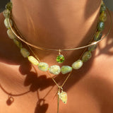 14k gold Wire Choker Necklace. Styled on a neck with a rounded Peridot solitaire charm layered with Nugget collar and chain and charm