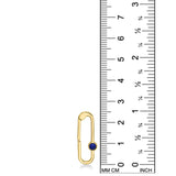 A 14K recycled yellow gold charm lock with lapis gemstone cabochon set against a ruler showing its height to be 25mm tall. 