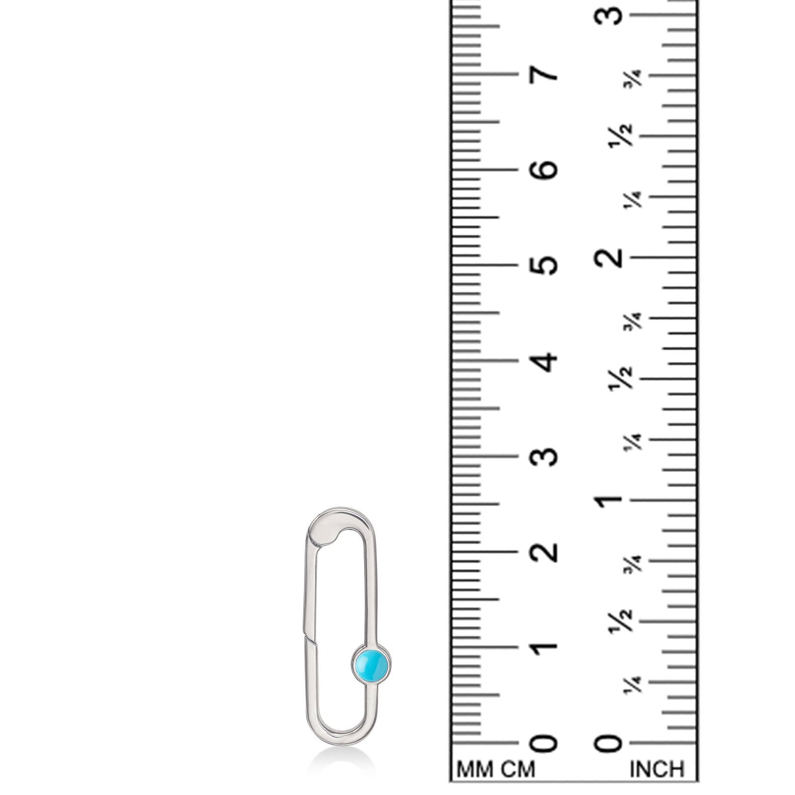 Recycled sterling silver charm lock with turquoise cabochon, from AMANDA PEARL, set against a ruler for scale.