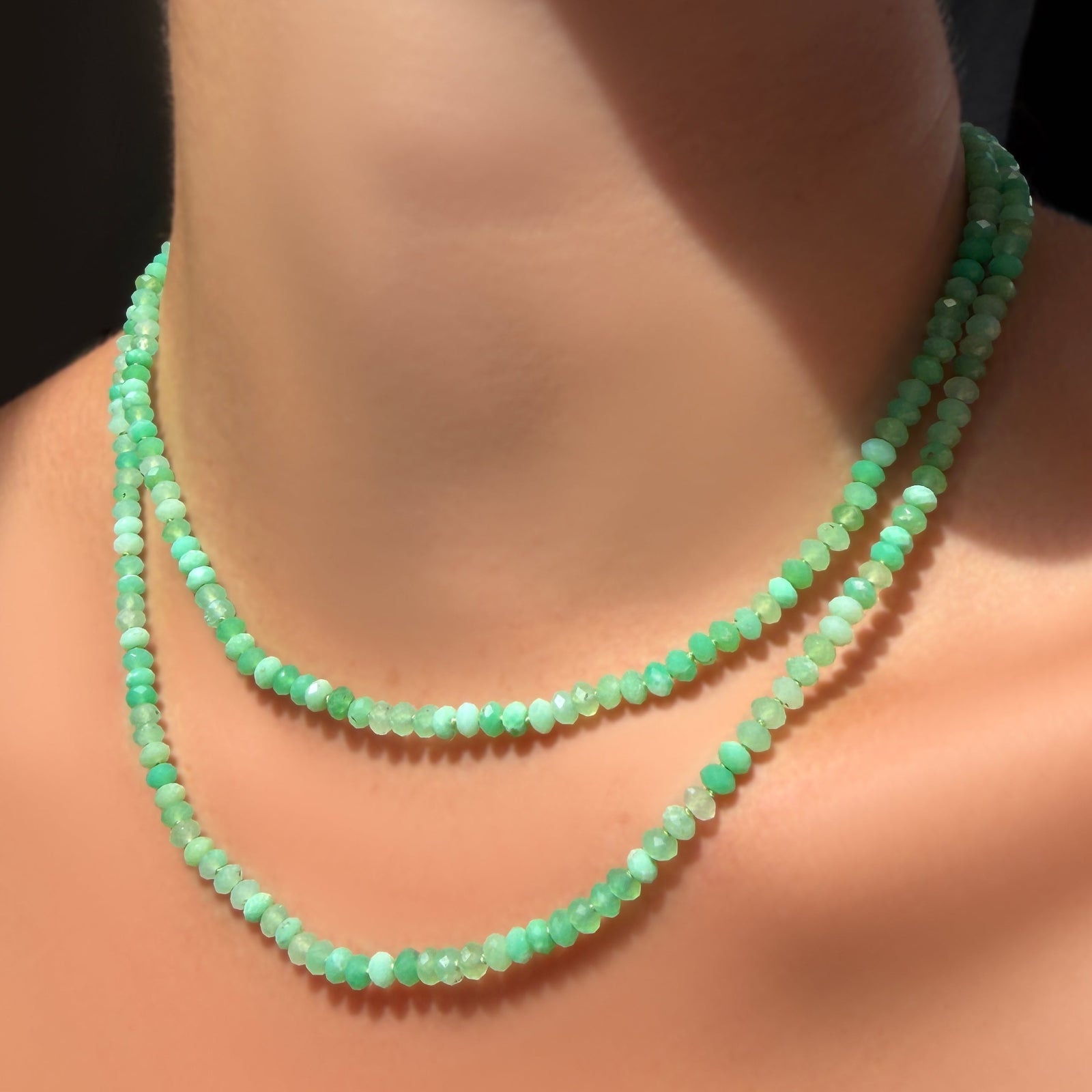 AMANDA PEARL a 16" and 18" Faceted Chrysoprase Necklace on Sterling Silver Evolution Clasp on a model's neck.