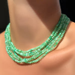 AMANDA PEARL a stack of Faceted Chrysoprase Necklaces on Sterling Silver Evolution Clasp on a model's neck.