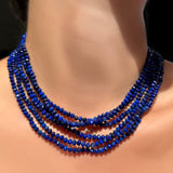 AMANDA PEARL Faceted Lapis Necklaces on Recycled Sterling Silver Evolution Clasps stacked on a model's neck.