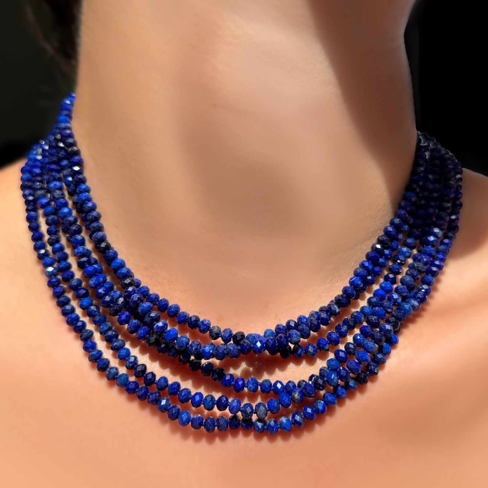 AMANDA PEARL Faceted Lapis Necklaces on Recycled Sterling Silver Evolution Clasps stacked on a model's neck.