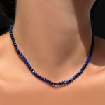 AMANDA PEARL Faceted Lapis Necklace on Recycled Sterling Silver Evolution Clasp on a model's neck.