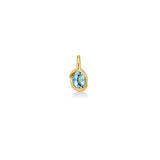 A 14K recycled yellow gold Molten knot pendant with a faceted blue topaz oval stone, on a white background. 