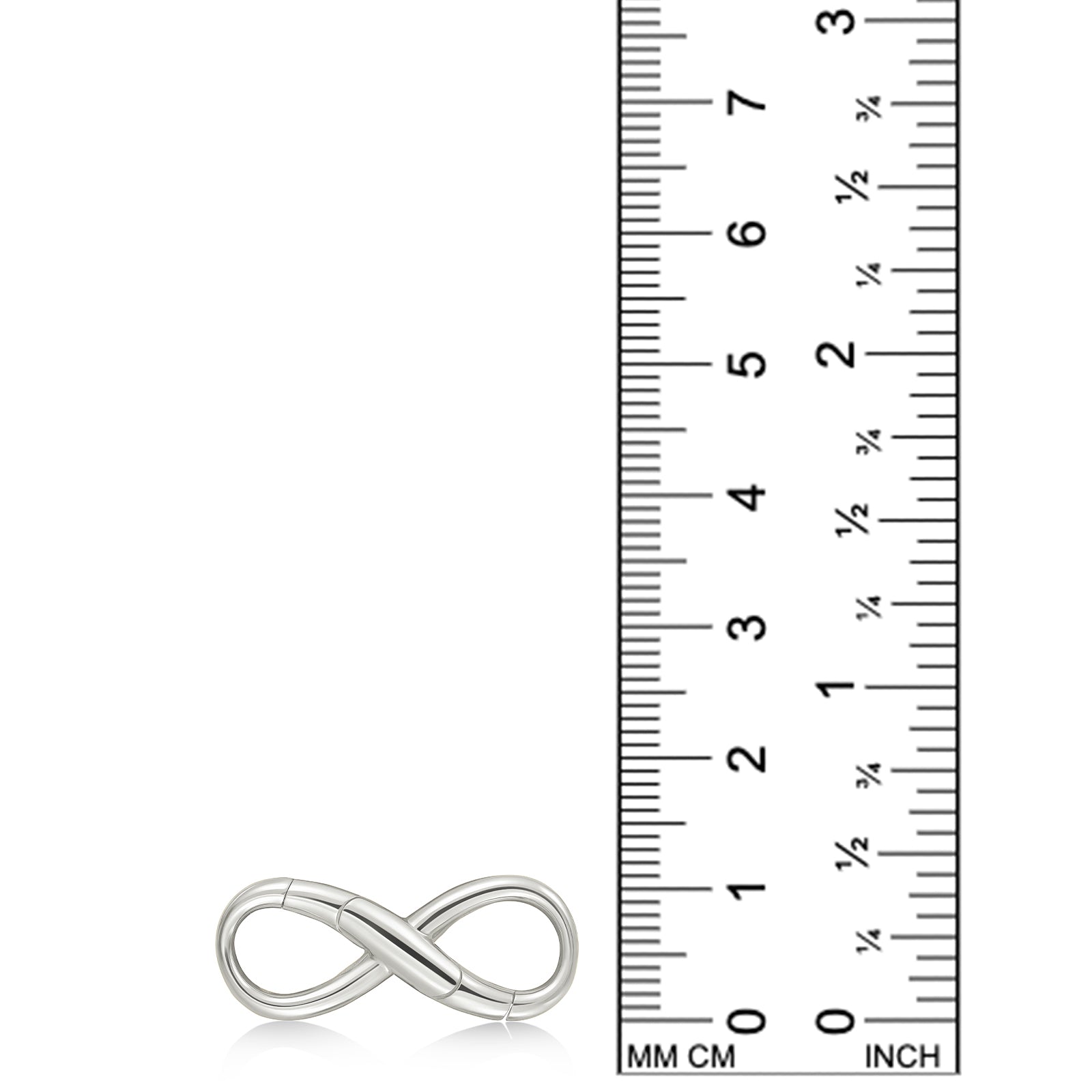 An AMANDA PEARL recycled sterling silver infinity charm lock sits against a ruler for scale