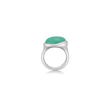 A molten pebble ring cast in recycled sterling silver with a chrysoprase stone from AMANDA PEARL sits on a white background with drop shadow.