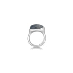 A molten pebble ring cast in recycled sterling silver with a rutilated quartz stone from AMANDA PEARL sits on a white background with drop shadow.
