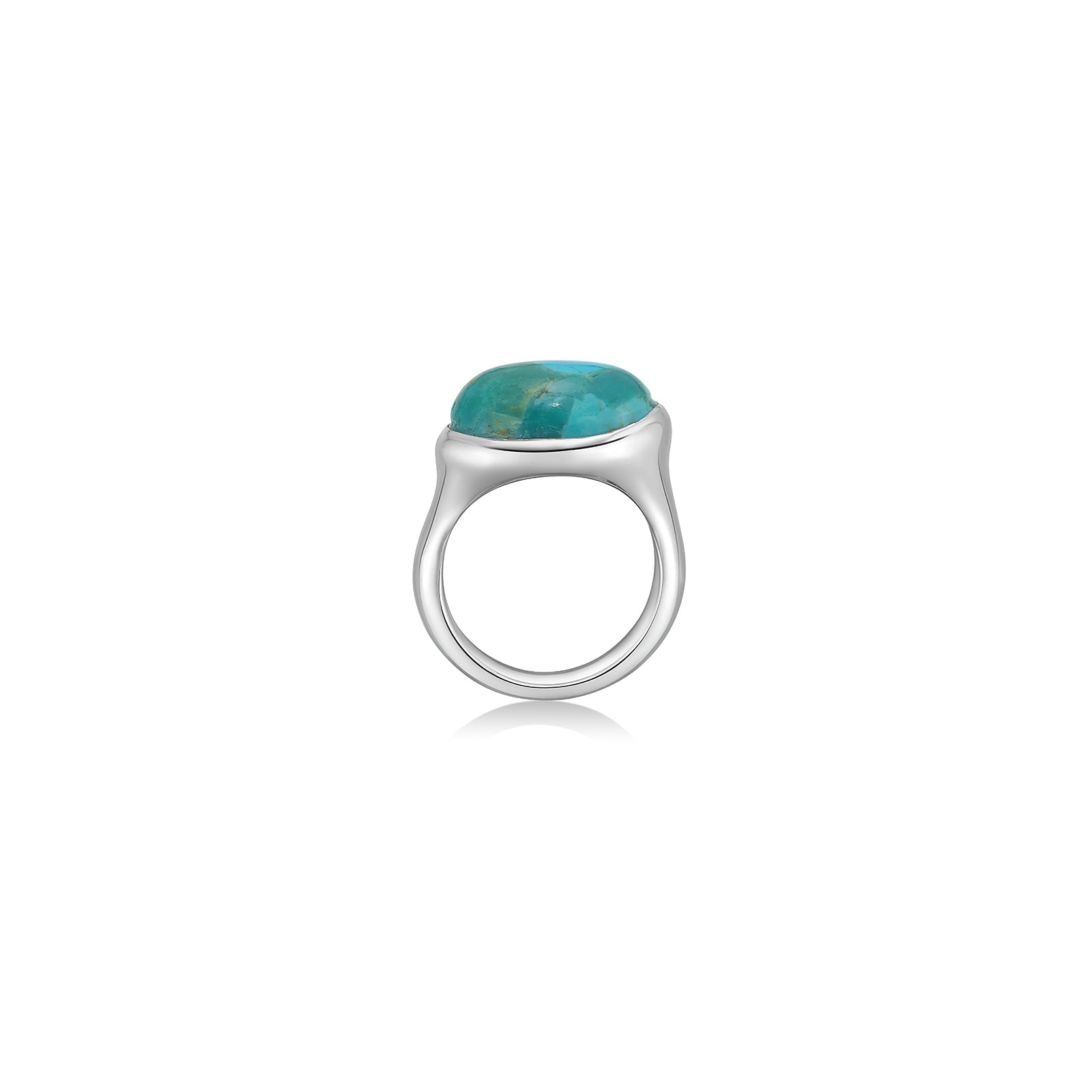 A molten pebble ring cast in recycled sterling silver with a turquoise stone from AMANDA PEARL sits on a white background with drop shadow.