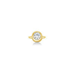front view of round molten solitaire ring in yellow gold against a white background