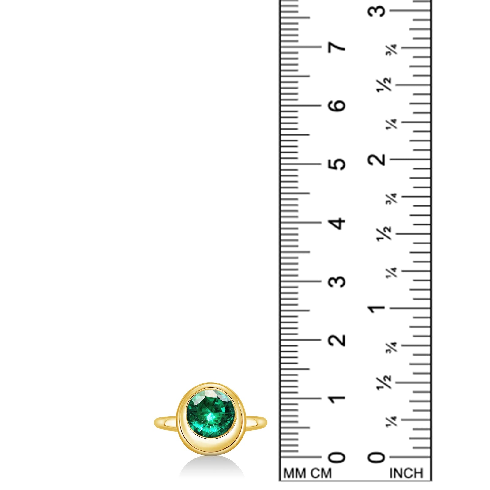 14K recycled yellow gold molten round solitaire with emerald, next to a ruler for scale, against a white background.