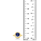 14K recycled yellow gold molten round solitaire with sapphire, next to a ruler for scale, against a white background.