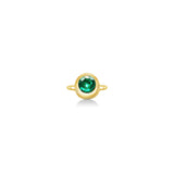 Molten solitaire ring in recycled 14k yellow gold with a round, cultivated emerald on a white background. 