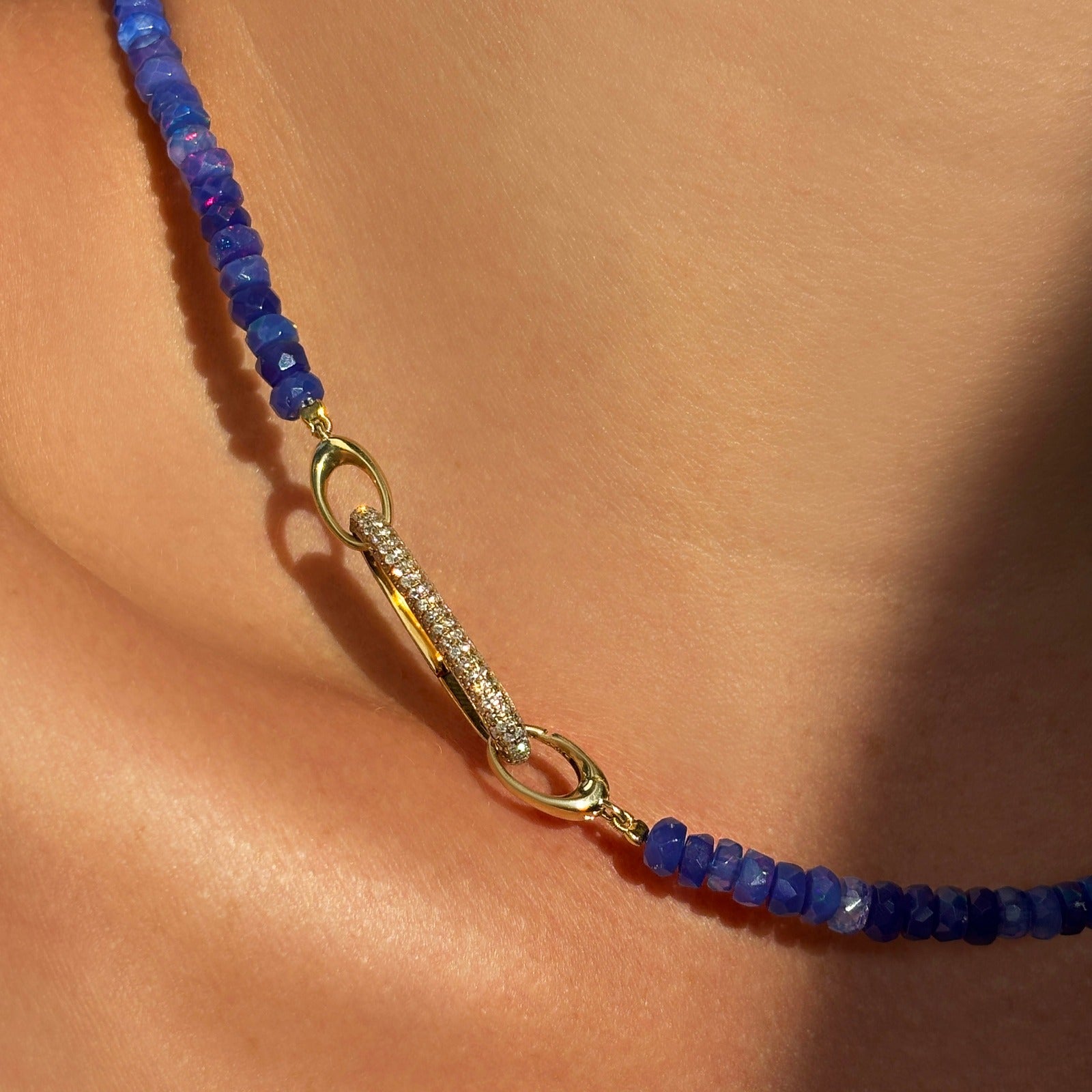 14k recycled yellow gold Pavé Oval Charm Lock styled with on a neck locked onto the Ultramarine Faceted Opal Necklace