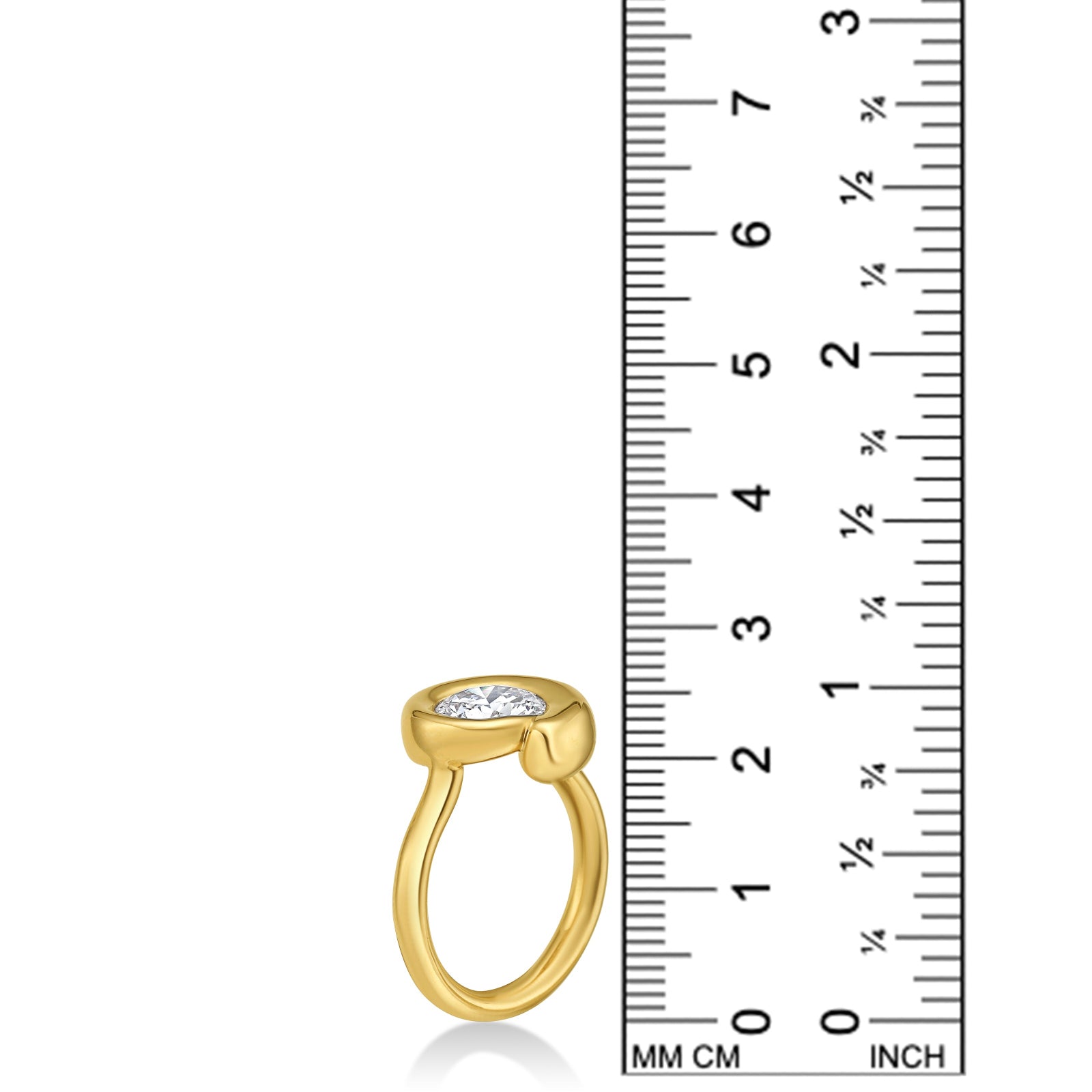 Quill Bezel Ring in yellow gold - against a ruler on a white background.