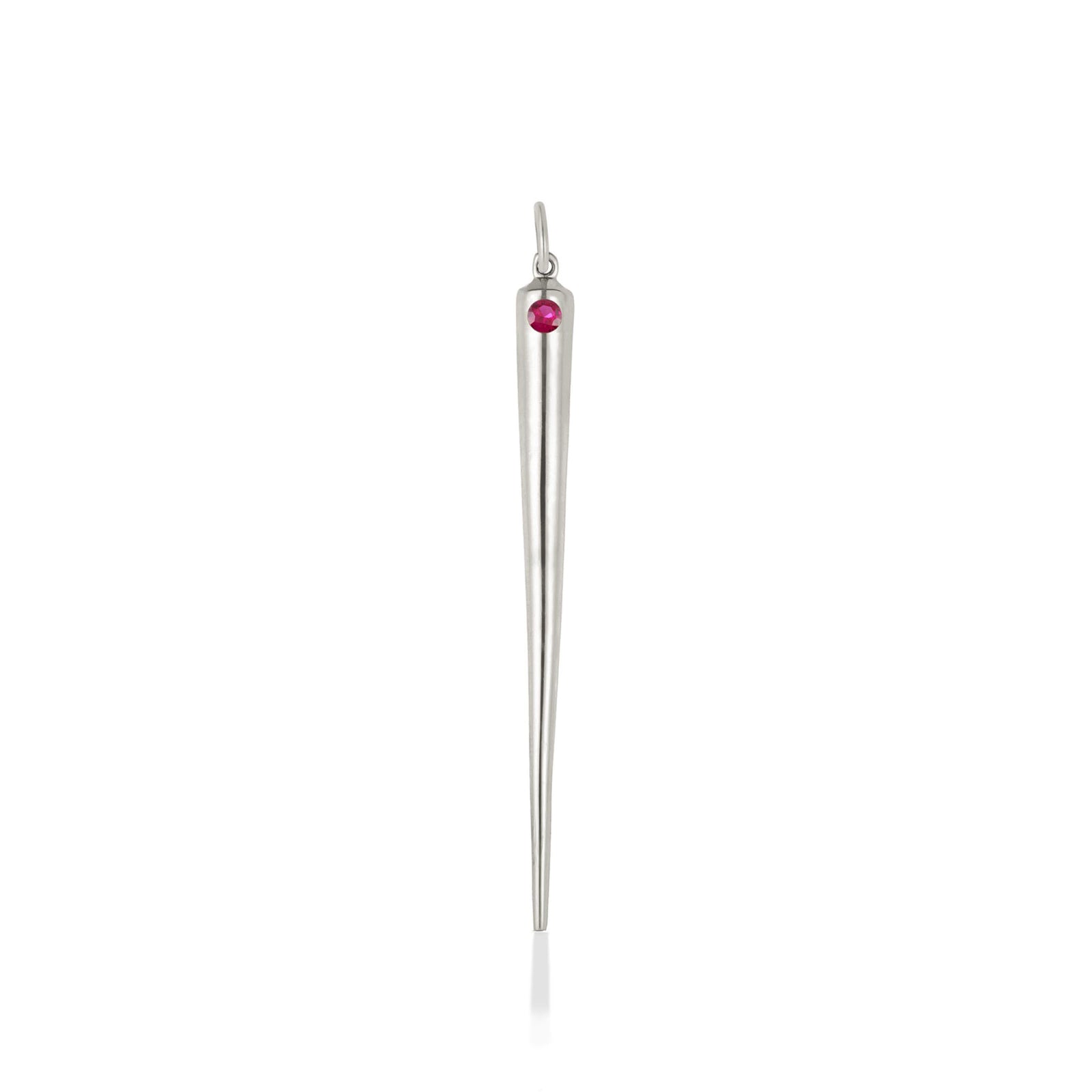 A quill spike charm cast in recycled white gold with a bezel set lab grown ruby, on a white background. 