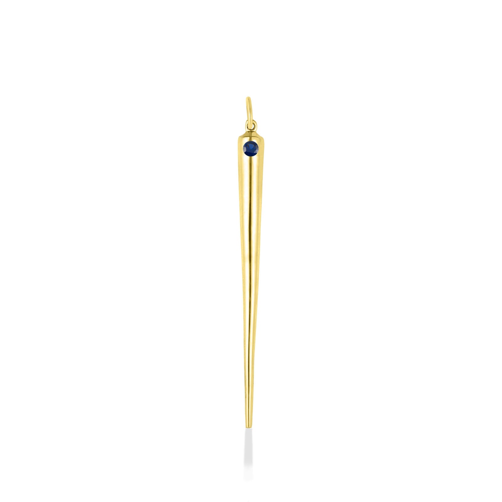 A quill spike charm cast in recycled yellow gold with a bezel set lab grown sapphire, on a white background. 