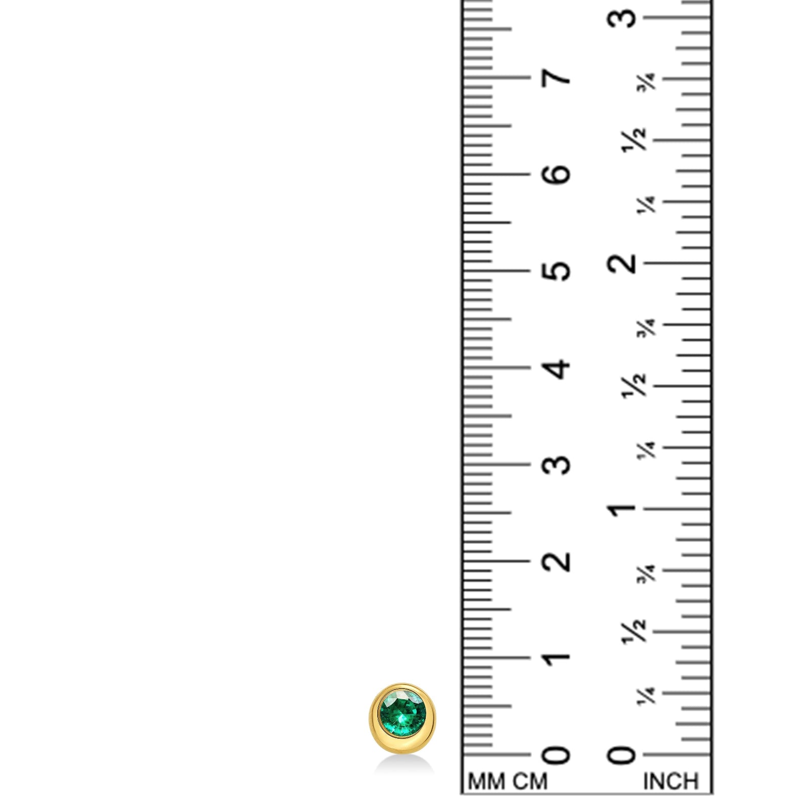 A round molten solitaire earring in 14K yellow gold with a bezel set emerald, set against a ruler for scale on a white background.