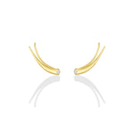 A pair of 14k recycled yellow gold climber earrings with a quill spike shape and a bezel set round diamond on a white background.