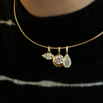 14K Recycled Gold Molten Round Solitaire Charm with Diamond accent layered on a wire choker with the Molten Marquise Solitaire Charm and Molten Pear Solitaire Charm