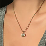 14K Recycled Gold Molten Solitaire Oval Charm styled on a Yellow Gold Bead Chain 