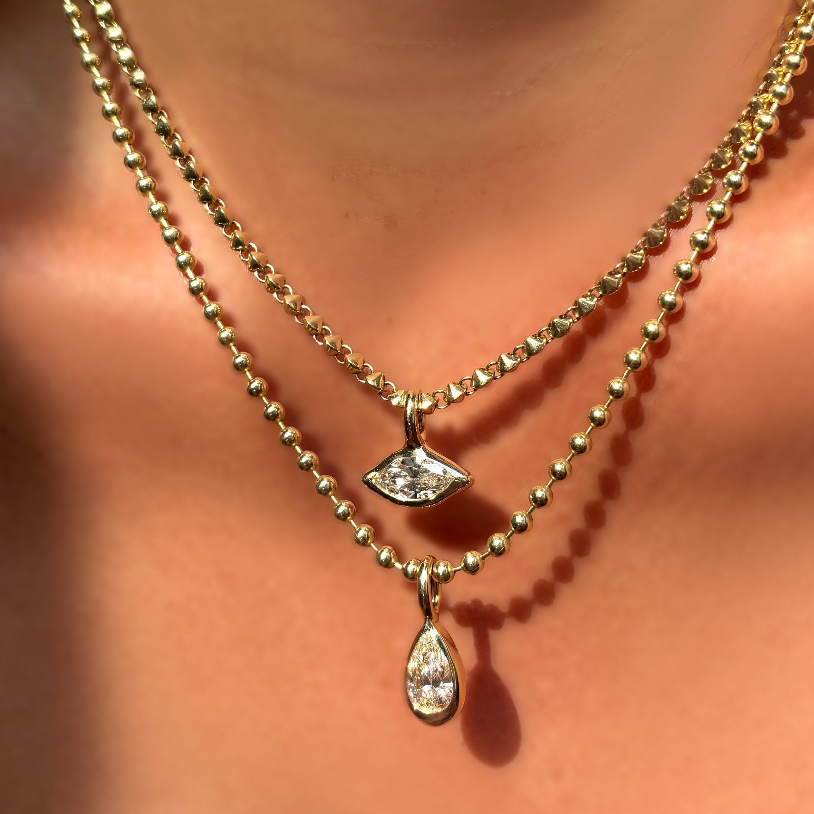 3mm bead chain with molten solitaire charm with pear layered under tibet chain with molten solitaire charm with marquise.
