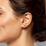 14k gold Curved Quill Climber Earrings styled on a ear