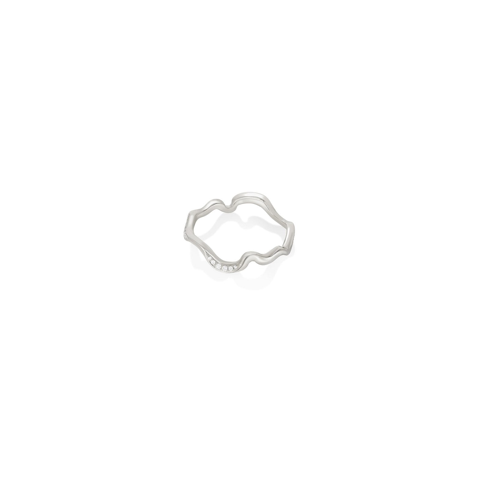 A 14K recycled white gold ripple ring, with a shape inspired by water and a surface studded with small ethical, lab grown diamonds. 