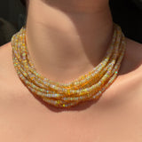 Eclipse opal necklaces layered on the neck.