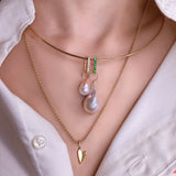 14K Gold Wire Choker Necklace styled with the Emerald Charm Lock and Diamond Charm lock with Baroque pearl charms attached.