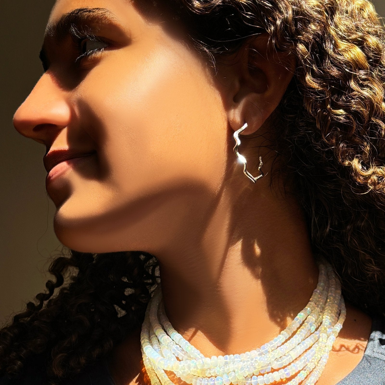 White Gold Diamond Pavé Ripple Hoop on a model. 