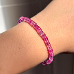 AMANDA PEARL Fuchsia Faceted Sapphire bracelet on a model's wrist.