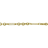 A close up of the links of the 6mm irregular paperclip chain from AMANDA PEARL in 14K yellow gold.